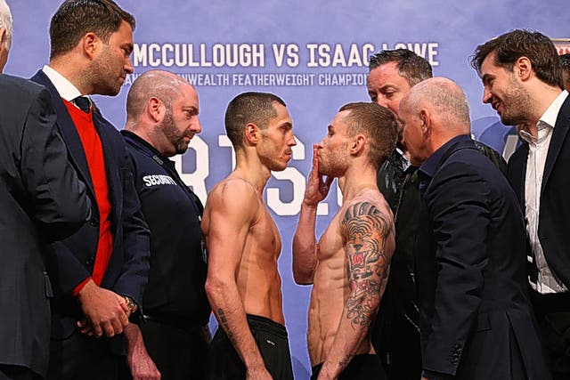 Carl Frampton (right) blows a kiss to Scott Quigg at Friday's weigh-in in Manchester