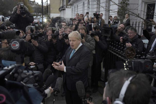 London Mayor Boris Johnson speaks to the media in front of his home in London