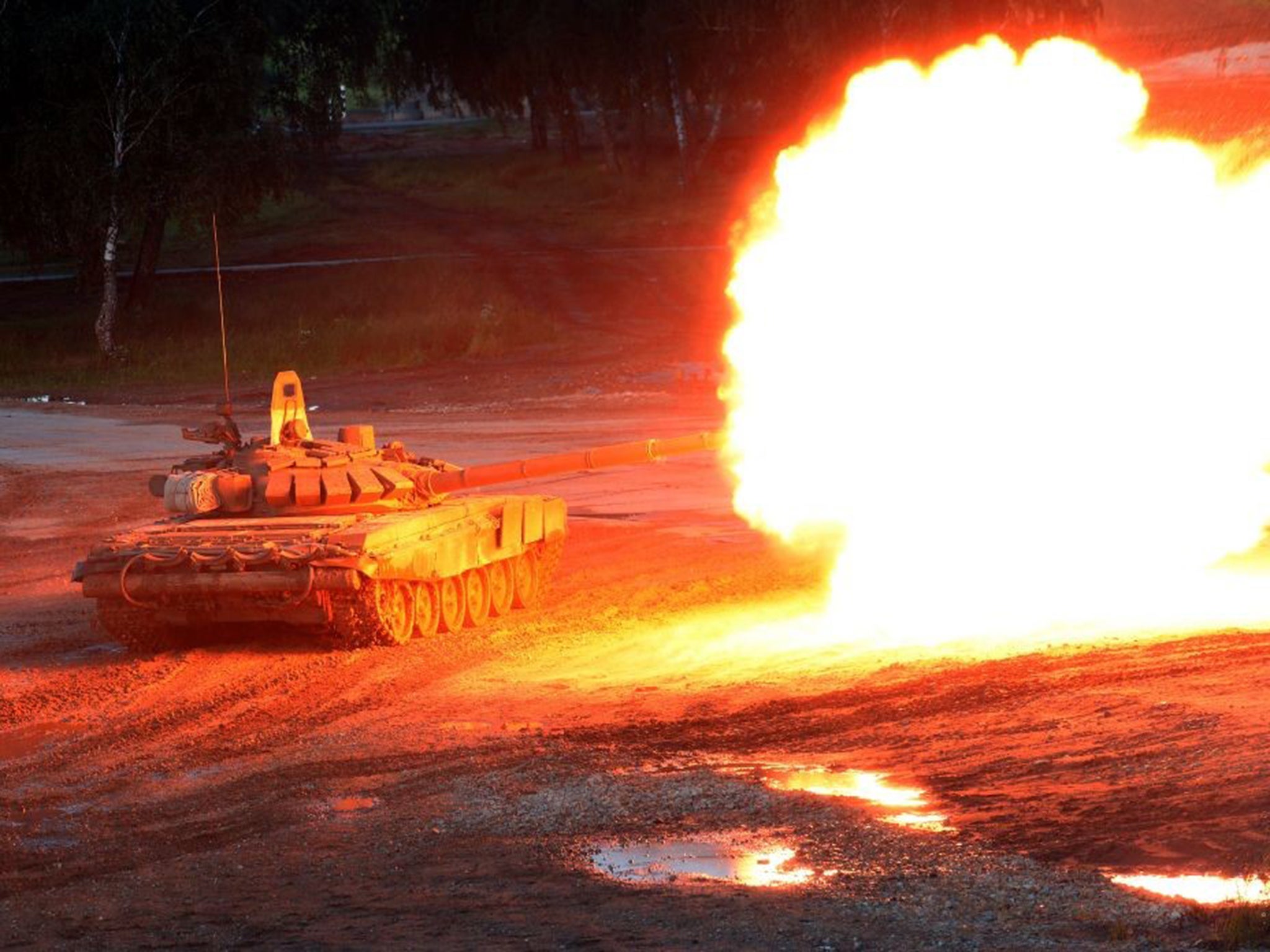 A Russian T-90 tank fires during the 'Army-2015' international military forum in Kubinka, outside Moscow.