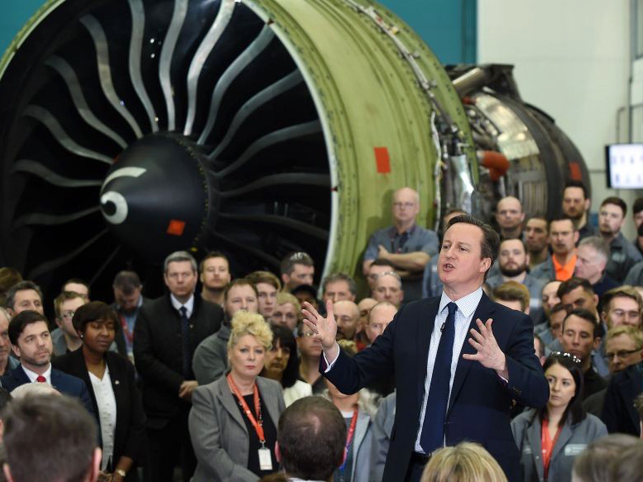 David Cameron speaks to employees during a question and answer session at GE Aviation in Cardiff yesterday
