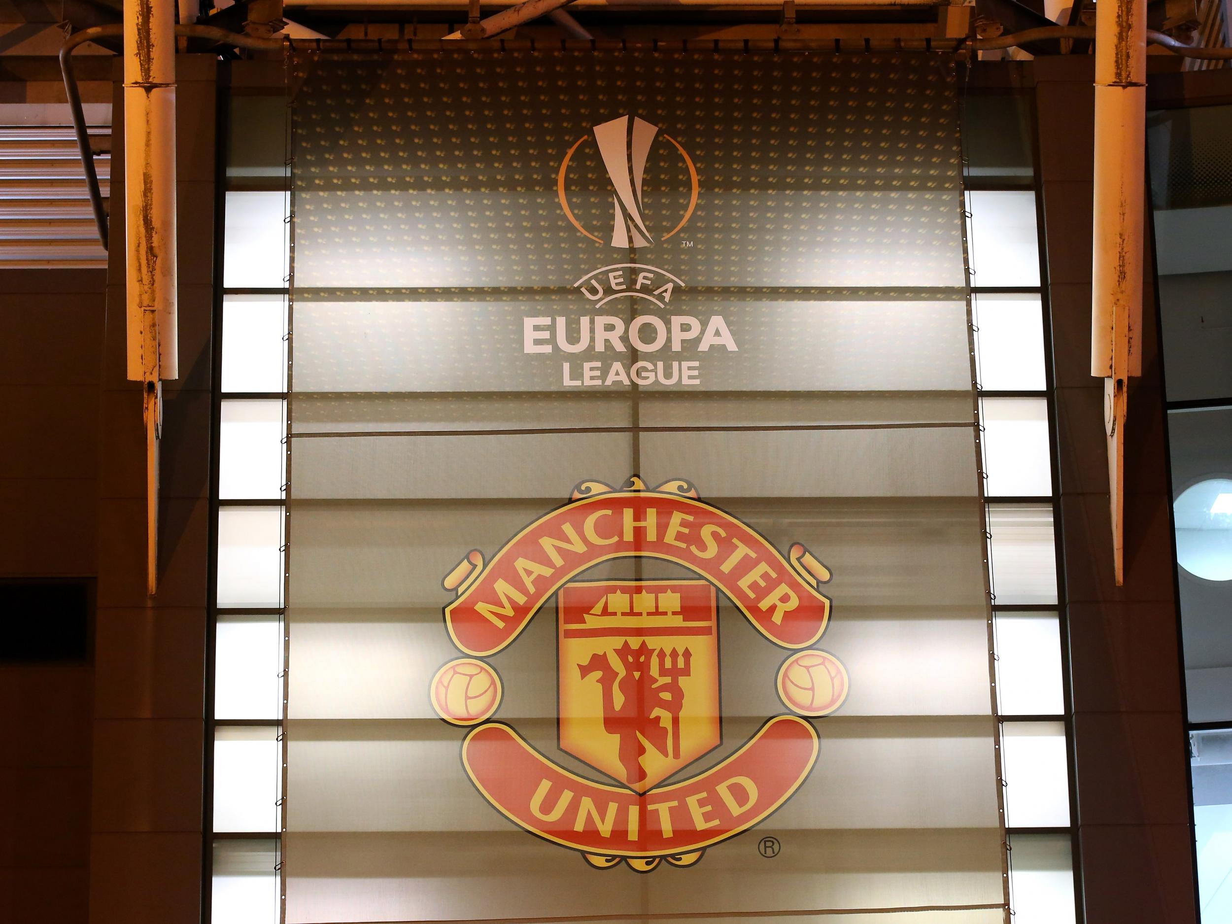 The Europa League logo adorns the side of Manchester United's Old Trafford home