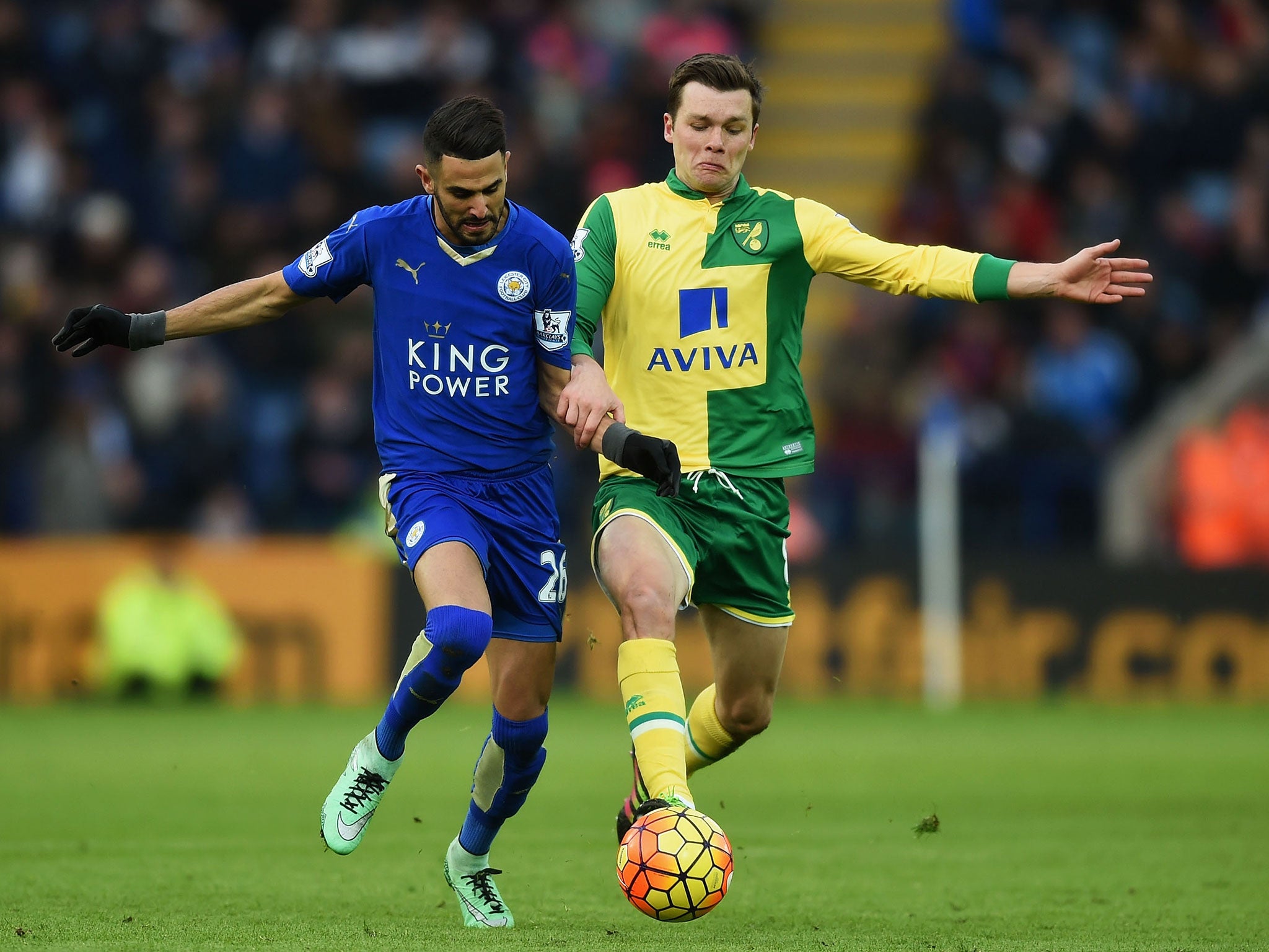 Riyad Mahrez and Jonathan Howson compete for the ball