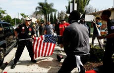 Four stabbed as KKK members clash with counter protesters