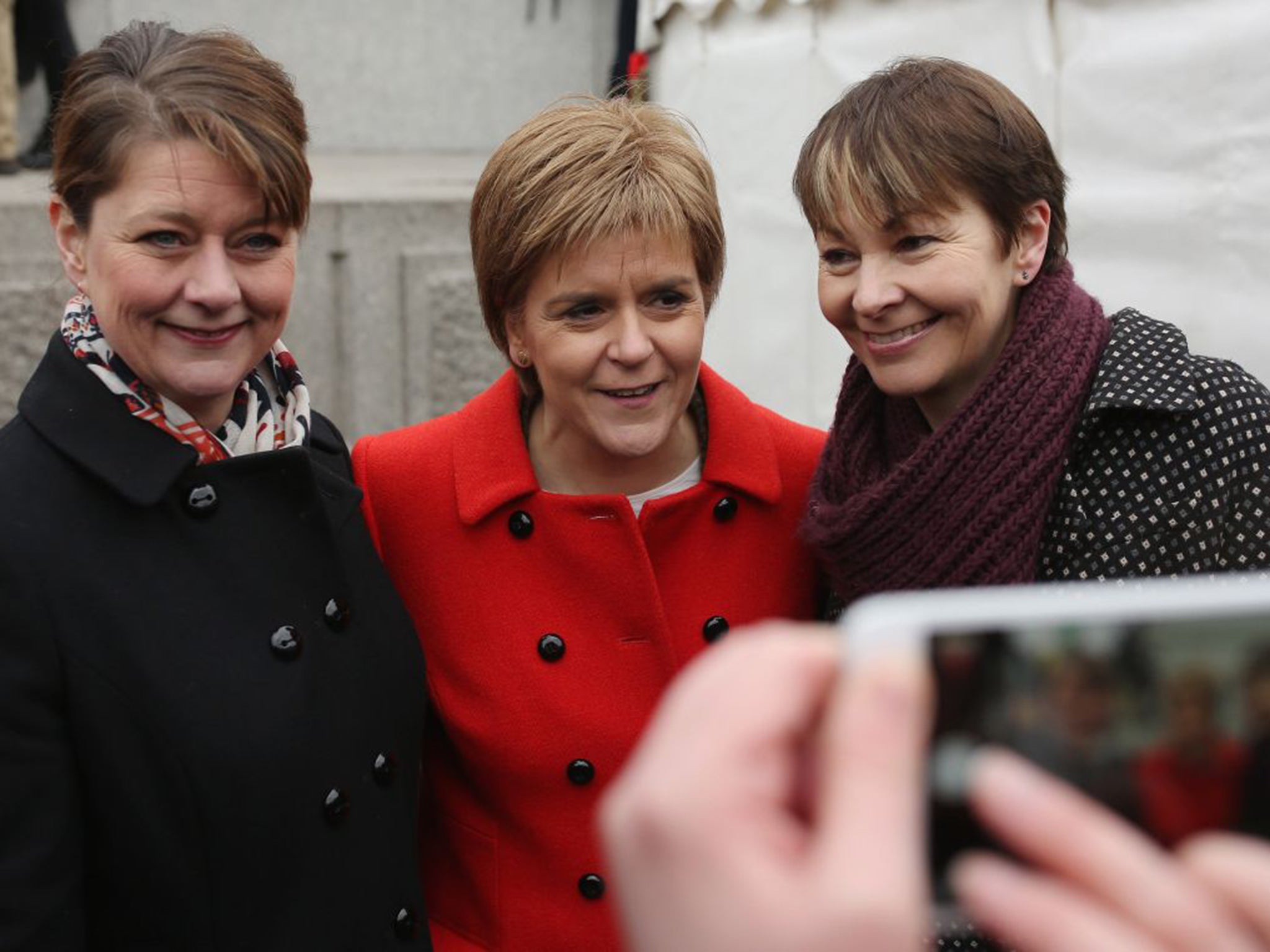 Nicola Sturgeon of the SNP flanked by Leanne Wood of Plaid Cymru, left, and Caroline Lucas of the Green Party