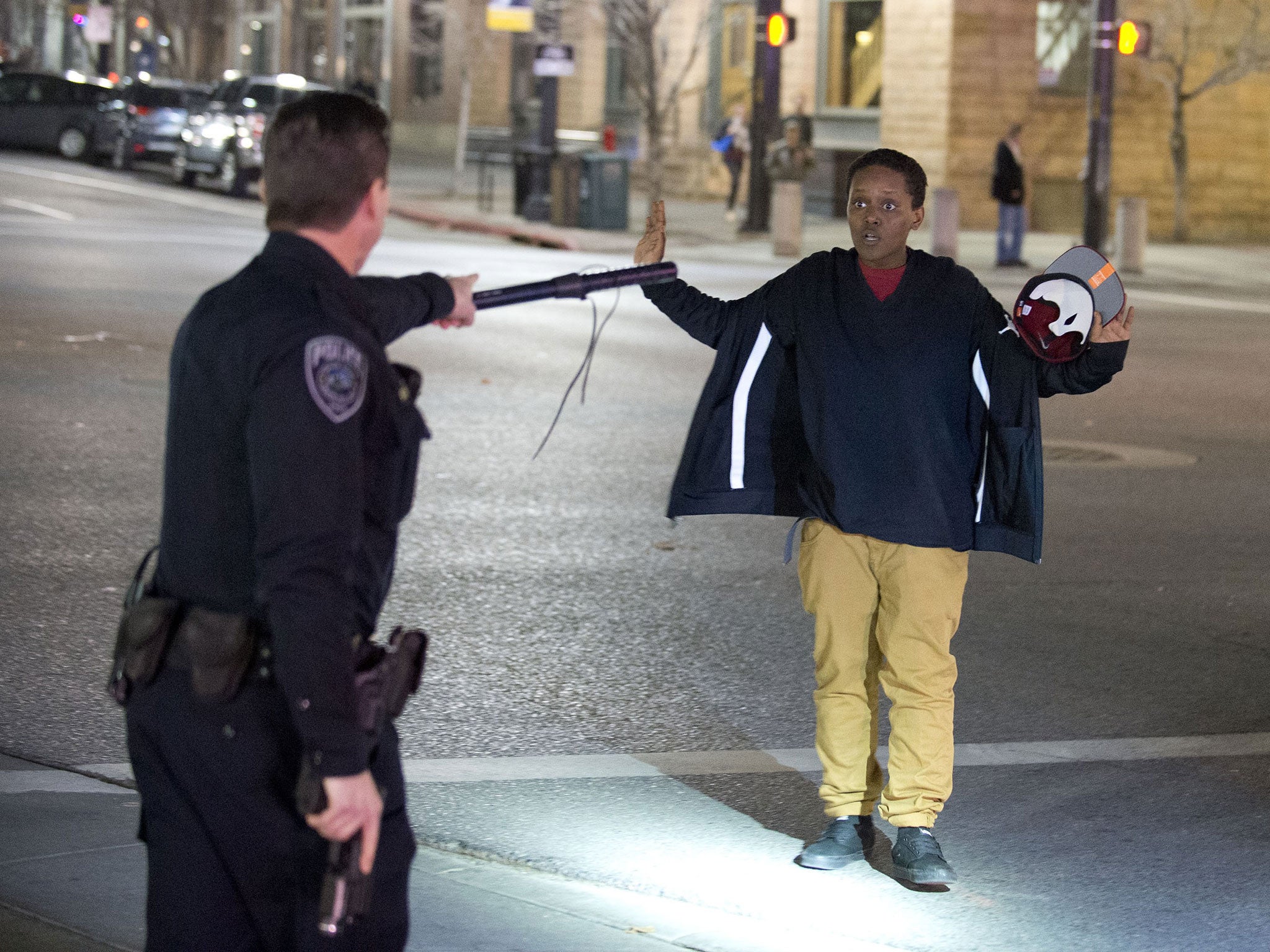 Selam Mohammad, a friend of the shot boy, was stopped by police as he walked away from the scene of the shooting at 200 South Rio Grande Street in Salt Lake City, 27 February 2016.