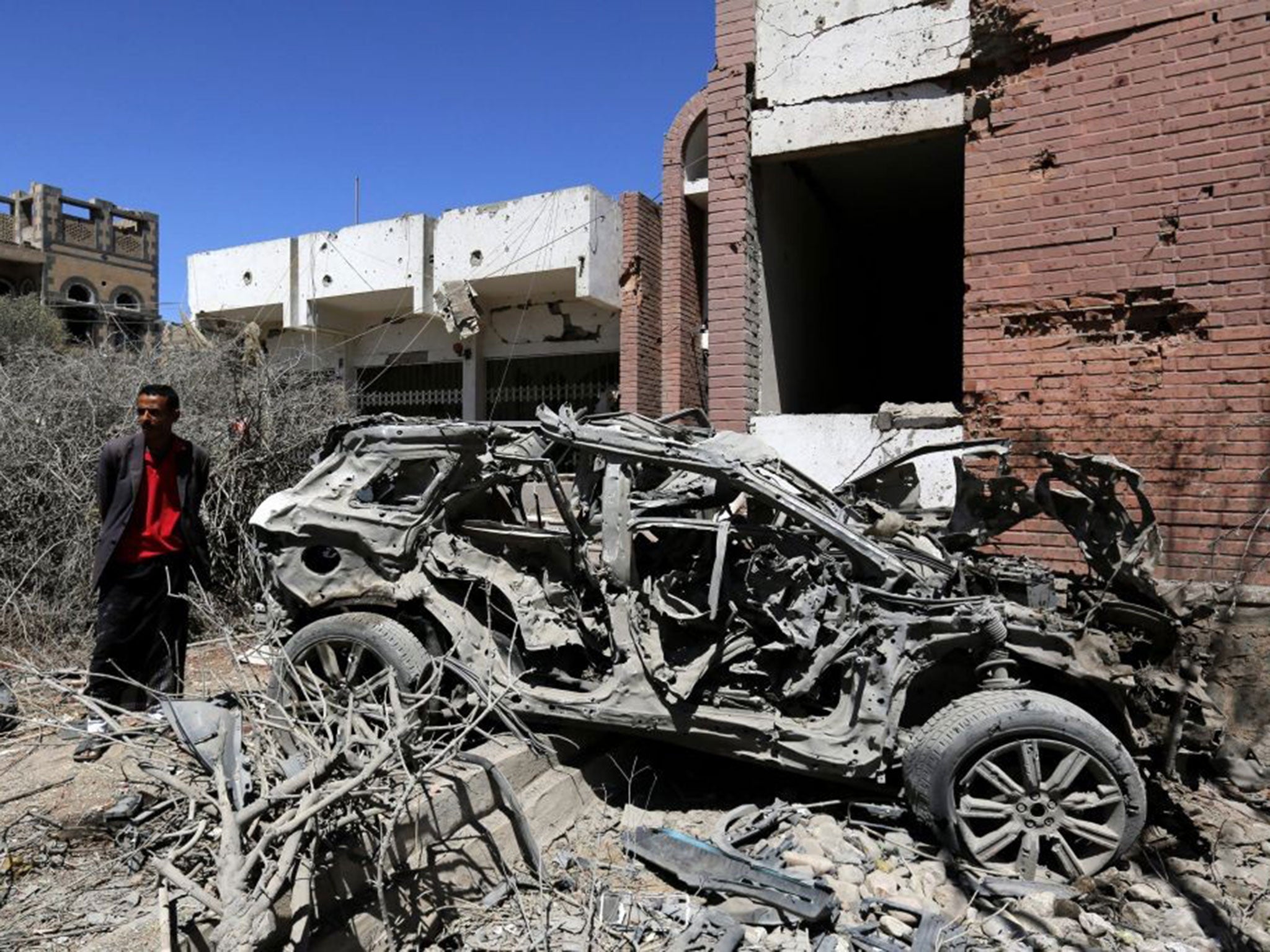 A Yemeni inspects the damage following a Saudi-led airstrike targeting a neighborhood in Sana'a, Yemen, 27 February 2016.