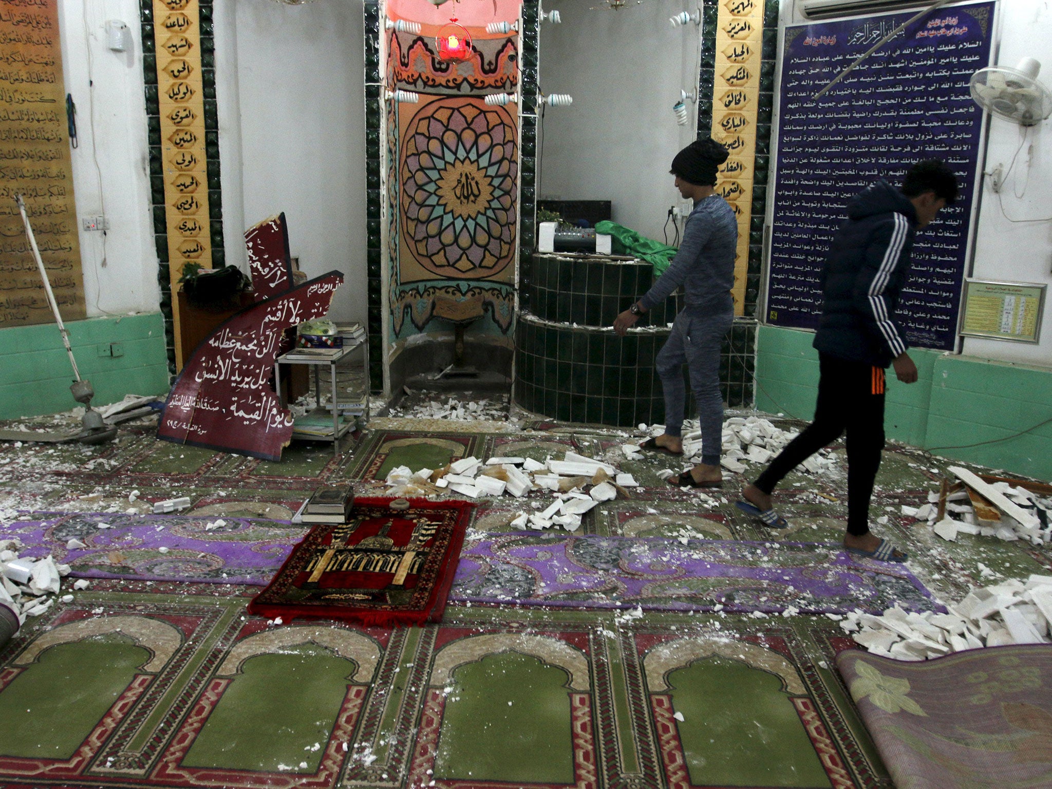 The aftermath of a suicide bombing of a Shia mosque in Baghdad