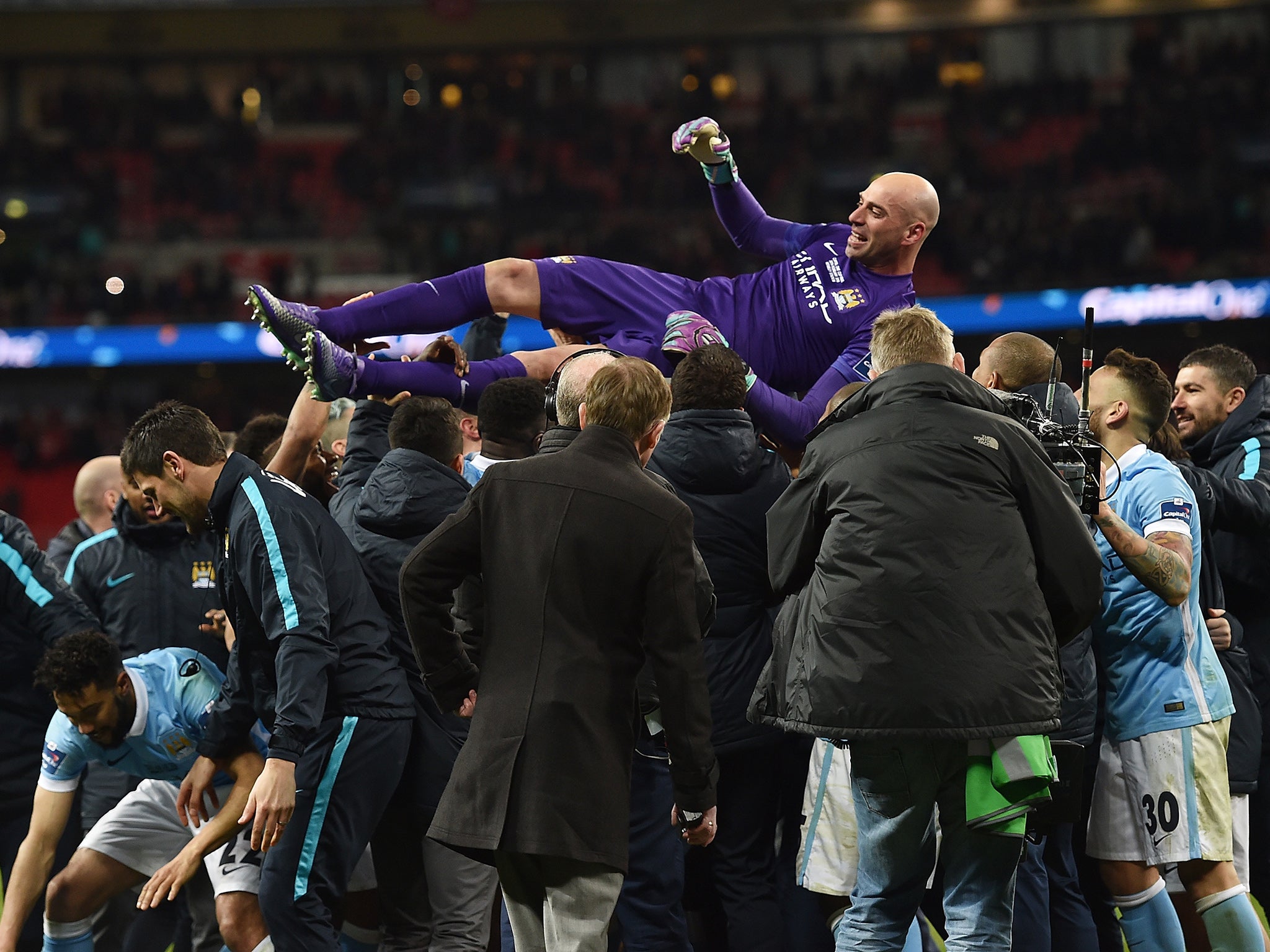 Manchester City's goalkeeper Willy Caballero is congratulated on his performance