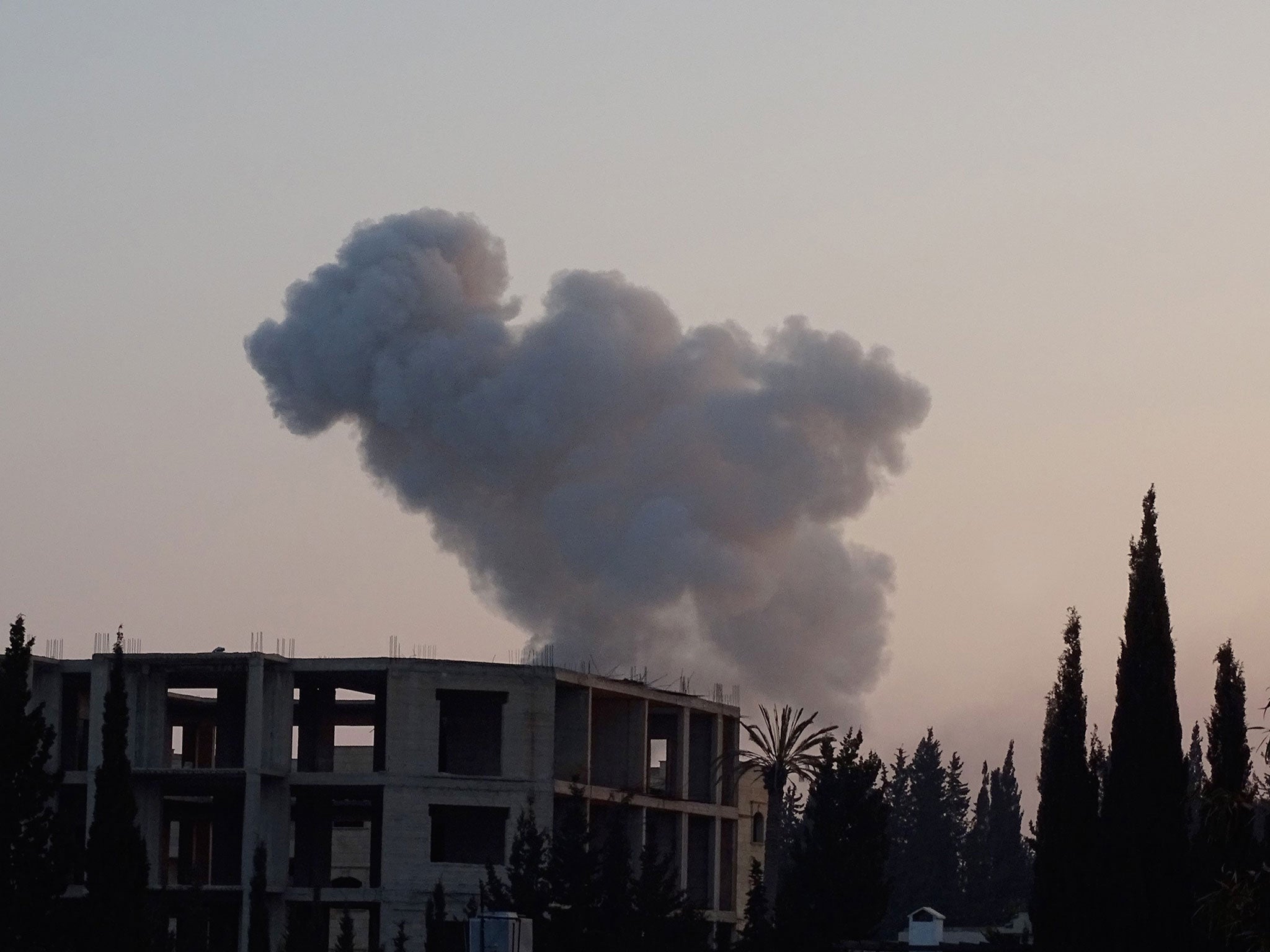 Smoke rises after Russian air strikes hit the village of Kafr Hamrah near Aleppo