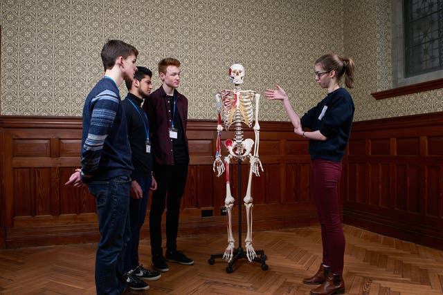 Medical student Rachel Fox talks to pupils at Gonville and Caius College