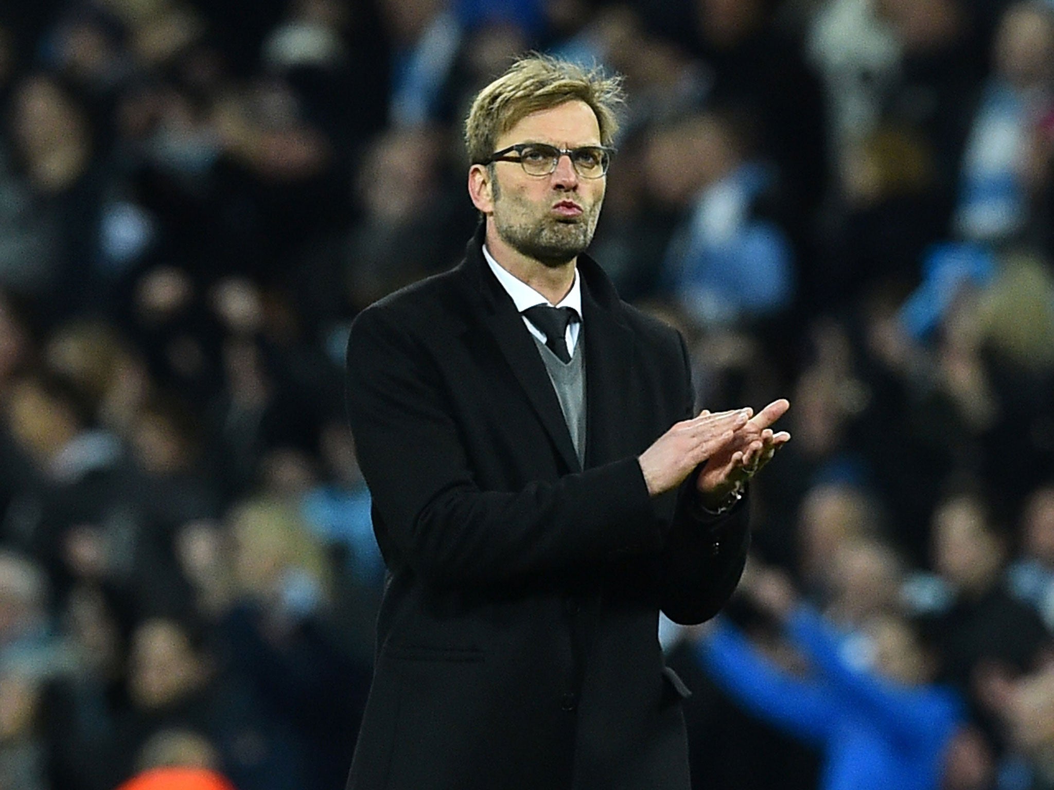 A disappointed Jürgen Klopp applauds the Liverpool fans at the end of the match