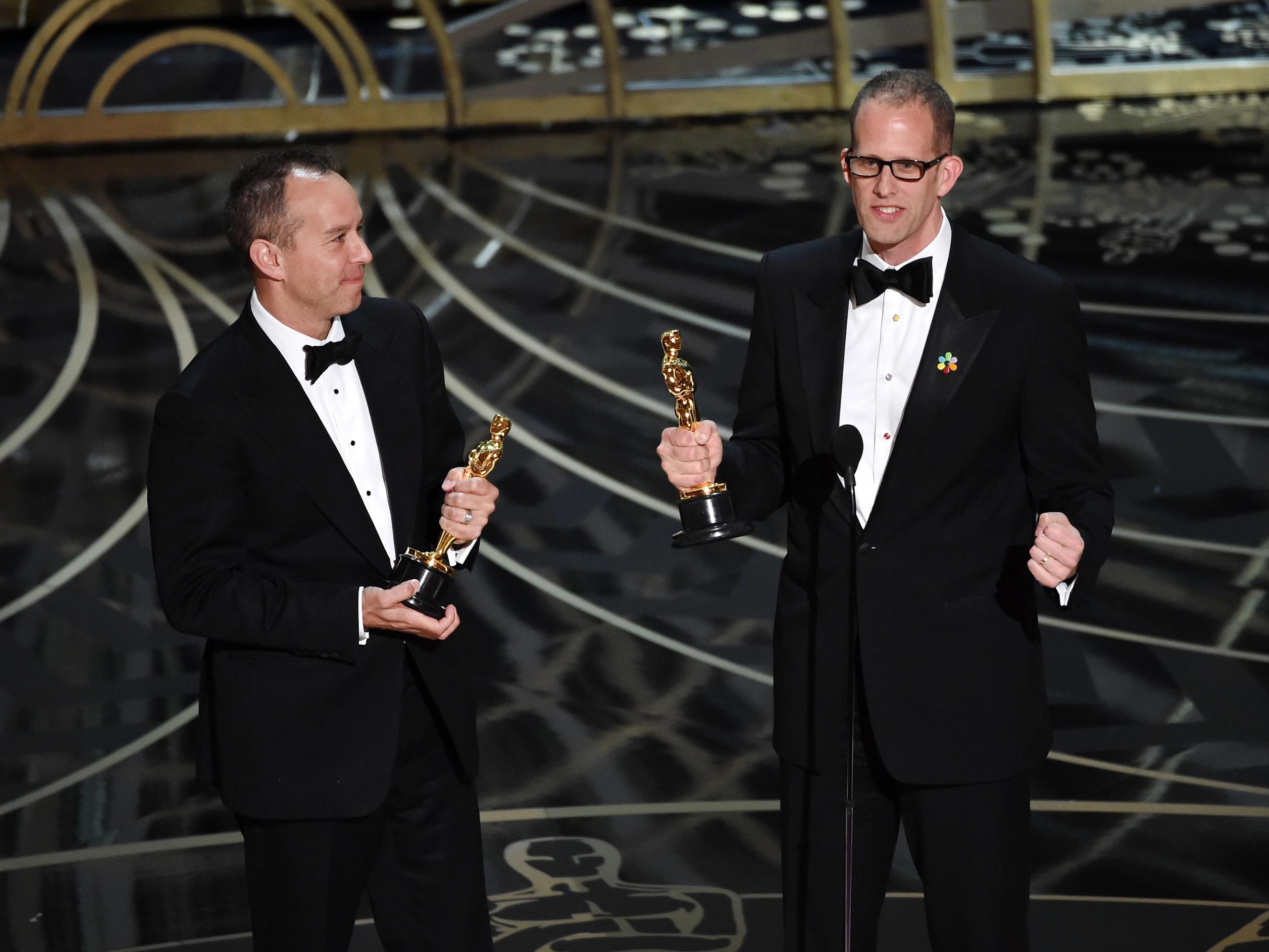 Producer Jonas Rivera (L) and director Pete Docter accept the Best Animated Feature Film award for 'Inside Out'