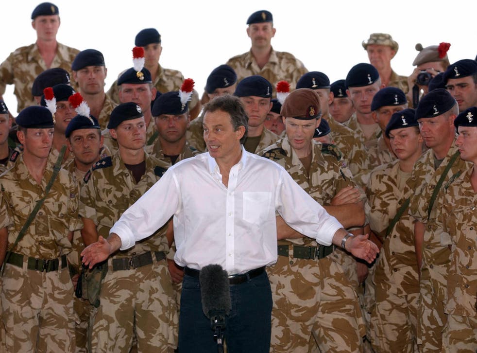 Tony Blair addressing troops in Basra, Iraq in May 2003 after the invasion. He has denied claims he wanted to invade the country as early as November 2001