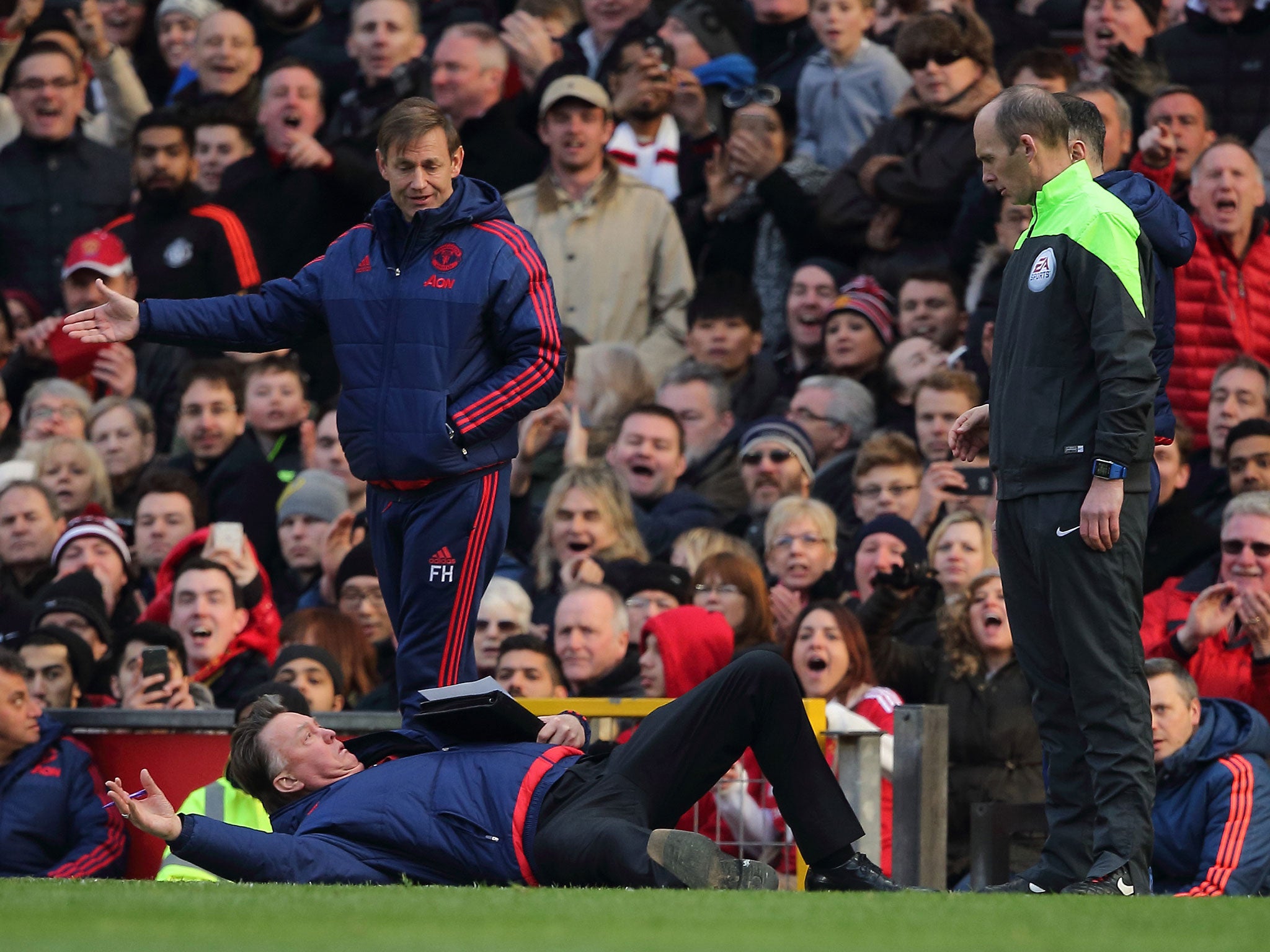 Louis van Gaal took to the floor during his side's win over Arsenal in February (Getty)