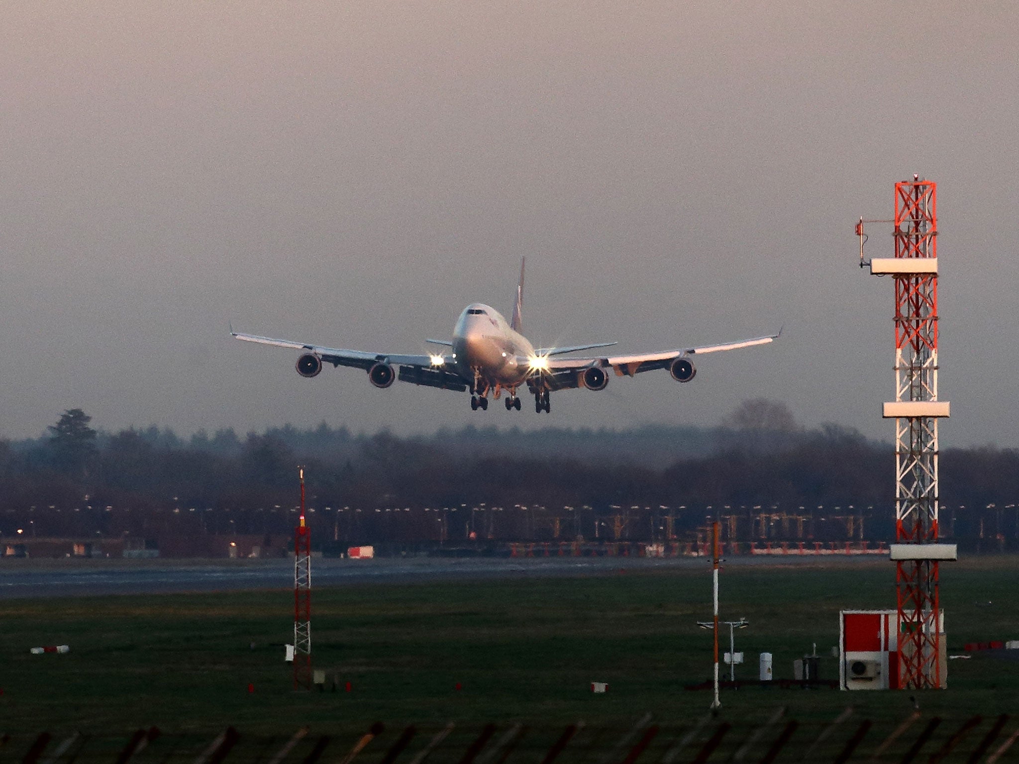 File: A plane comes in to land at Gatwick Airport