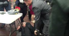 Photographer 'choke-slammed' by security guard at Trump rally
