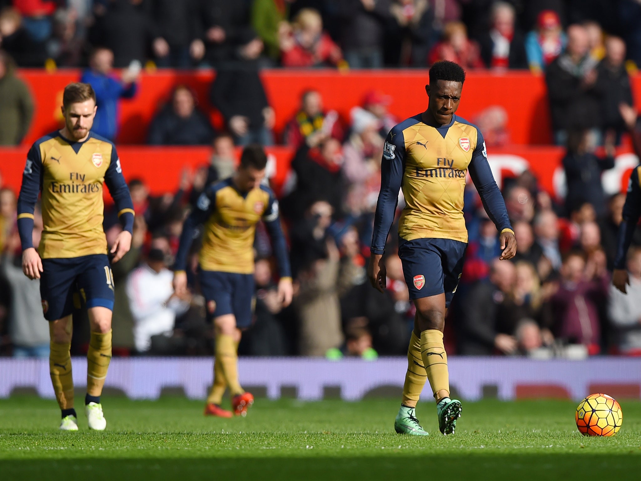 Arsenal players react during the defeat at Old Trafford