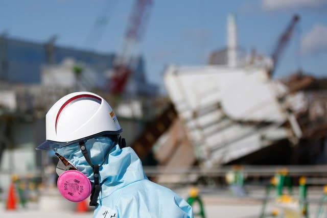 A Tokyo Electric Power Co. (TEPCO) employee tours the Fukushima nuclear power plant. Japan is preparing to mark the fifth anniversary of the disaster