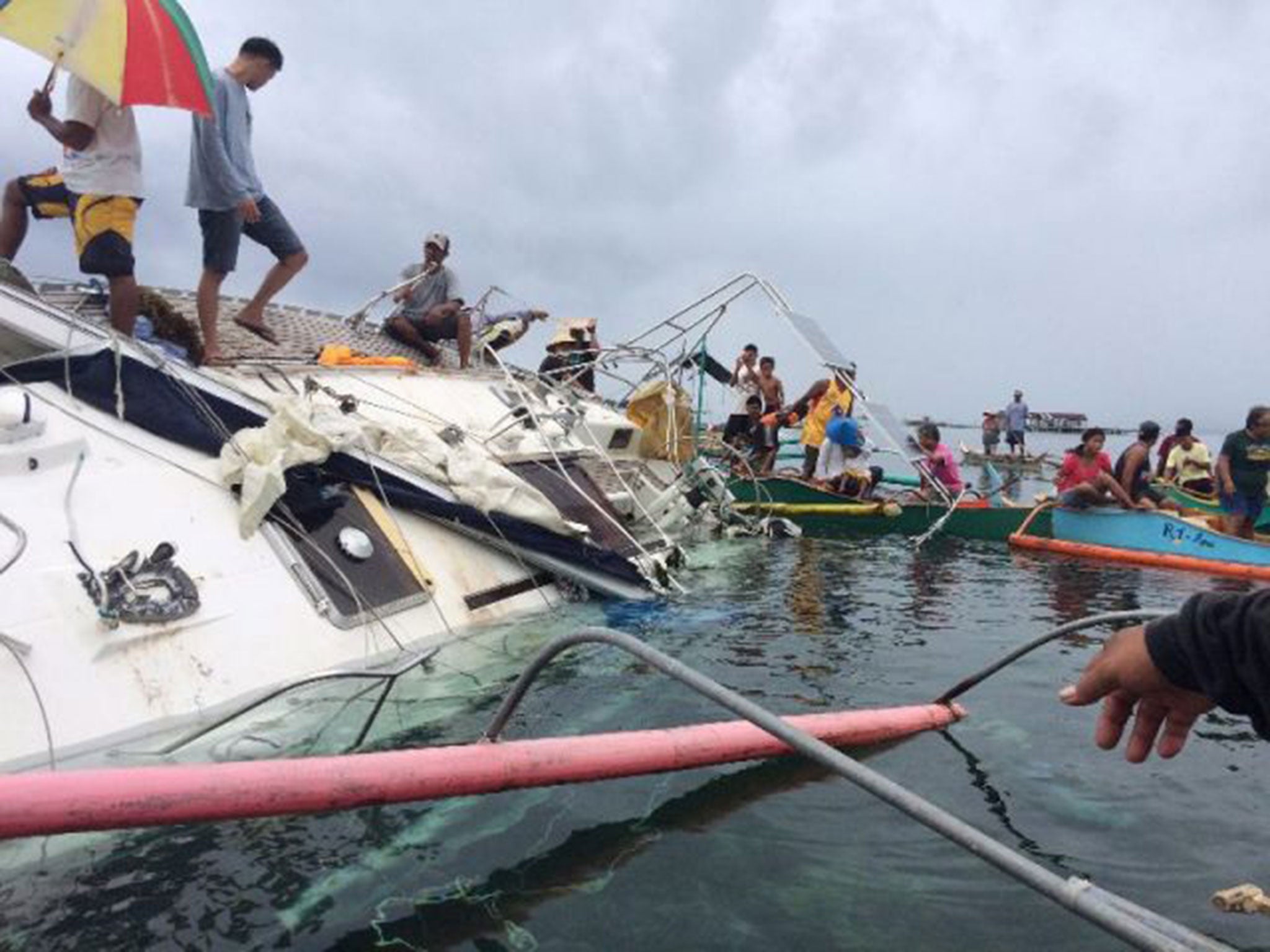 Fishermen recover the yacht off Barobo in the Philippines, in which the mummified sailor was discovered