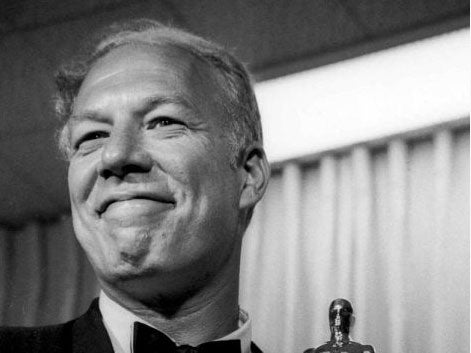 George Kennedy poses with his Oscar in Santa Monica, Calif, after winning best supporting actor for "Cool Hand Luke."