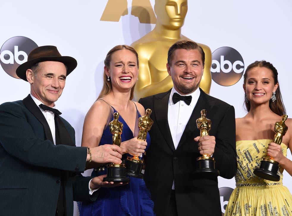 (L-R) Best Supporting Actor Mark Rylance, Best Actress Brie Larson, Best Actor Leonardo DiCaprio and Best Supporting Actress Alicia Vikander pose with their Oscar in the press room during the 88th Oscars in Hollywood