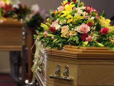 Two women arrested for brawling in front of relative's casket at funeral home