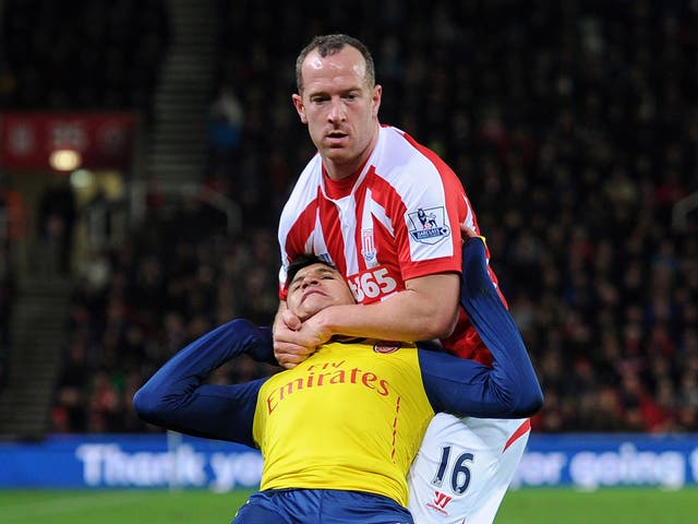 Stoke City's Charlie Adam challenges Arsenal's Alexis Sanchez during the 2014/15 season