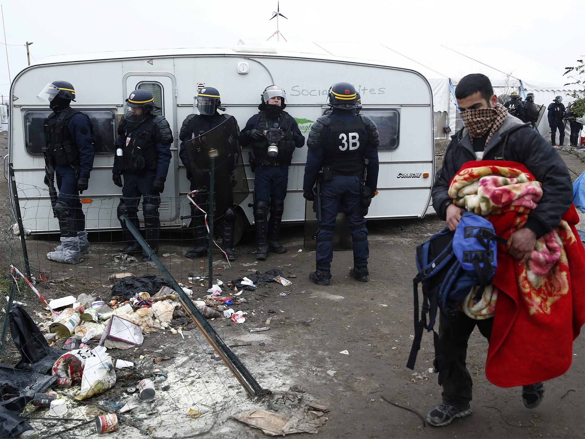 French riot police secure an area inside the camp