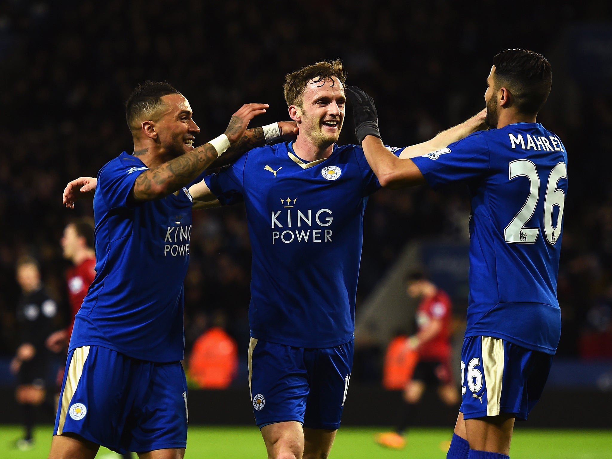 Andy King celebrates his goal with team-mates Danny Simpson and Riyad Mahrez