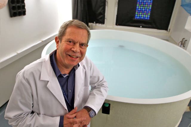Professor Richard Morris from the University of Edinburgh Neuroscience Department beside the 'Morris Water Maze'