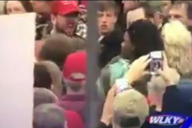 Footage captured by WLKY television showed the woman being shoved and shouted at by Trump supporters