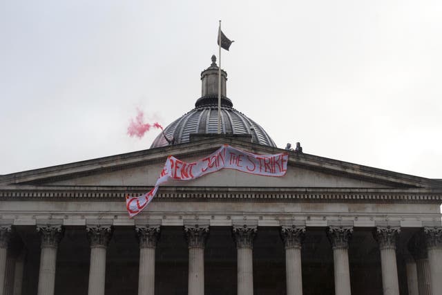 UCL Cut the Rent activists drop a banner from the roof of the Wilkins Portico, UCL's main building