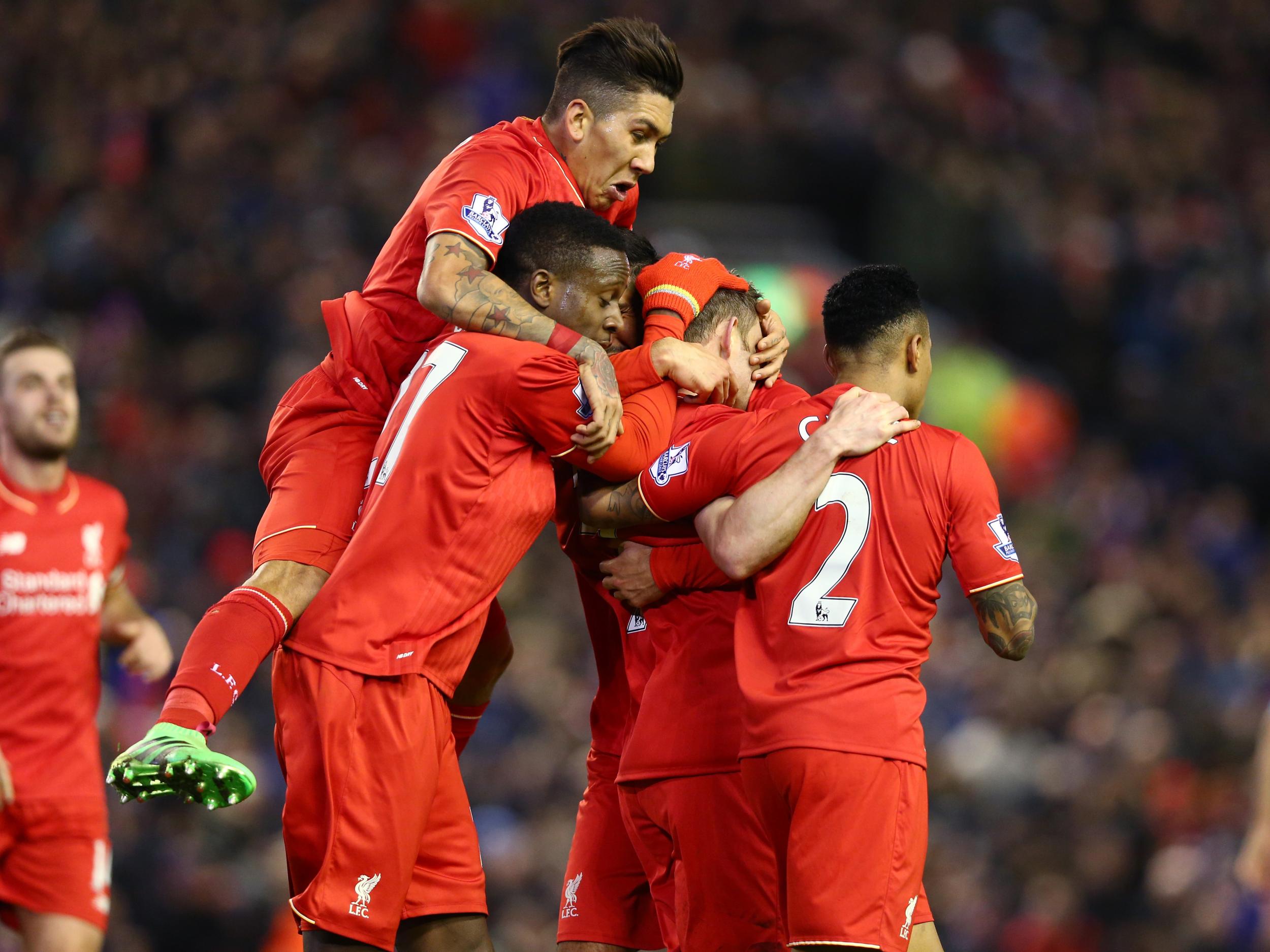 Liverpool players celebrate beating Manchester City