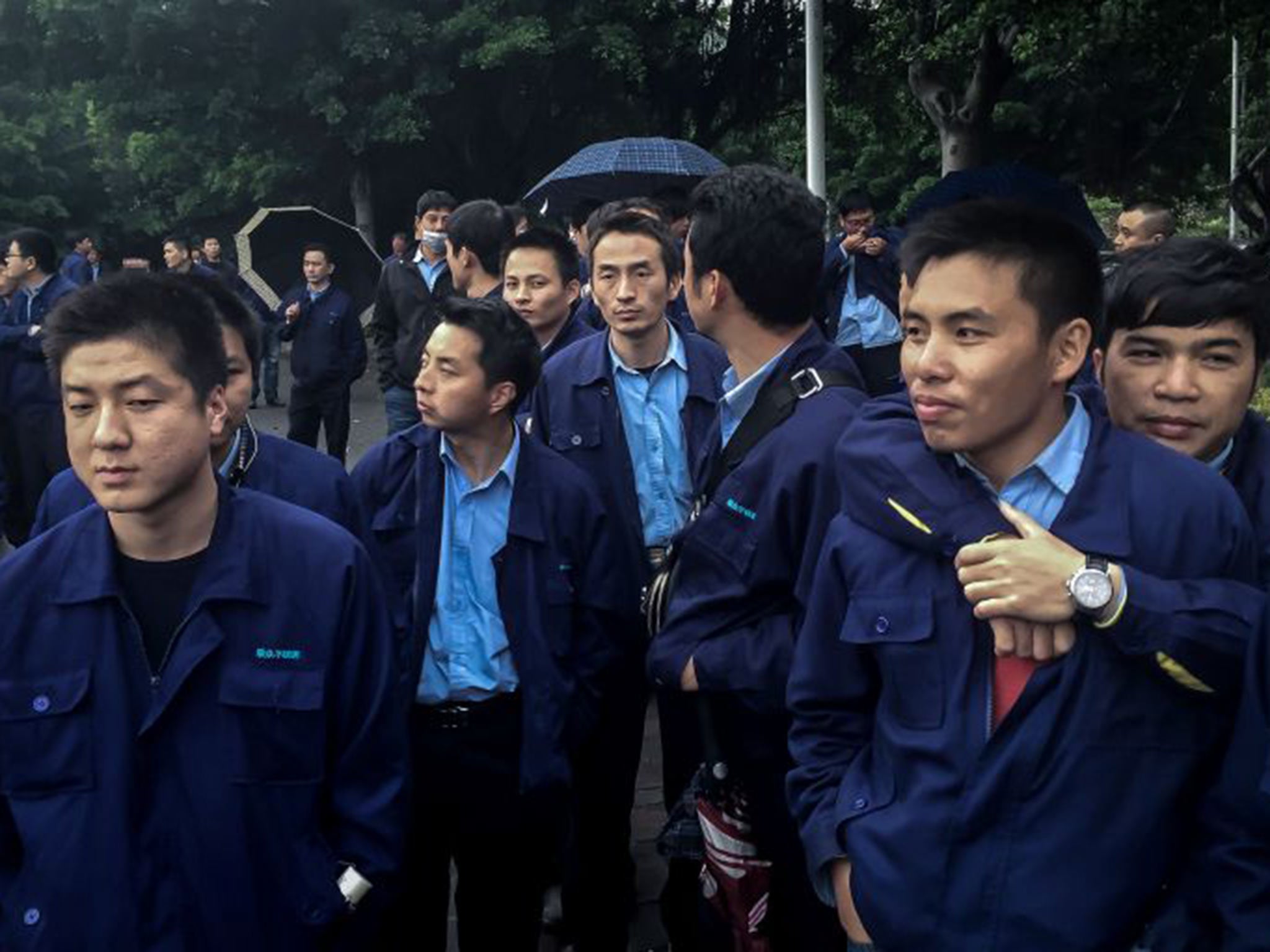 Steel workers in Guangzhou went on strike in a campaign for pension benefits (Billy Kwok/Washington Post)