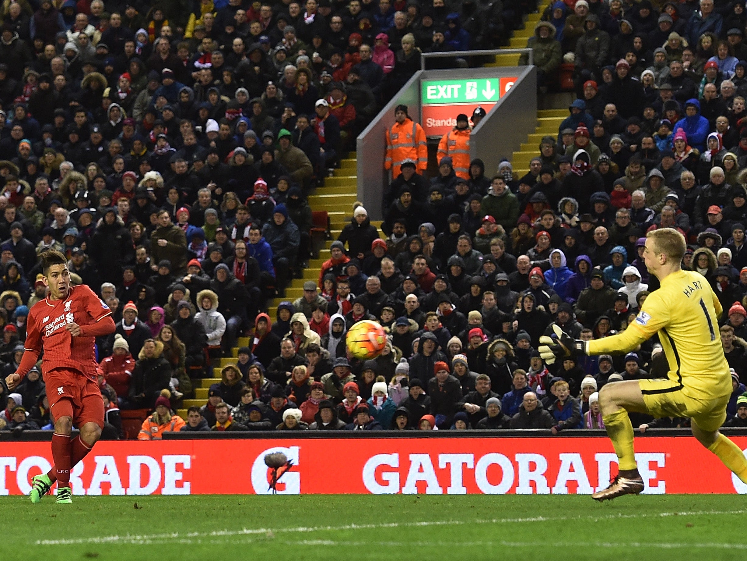 Roberto Firmino curls it around Manchester City goalkeeper Joe Hart