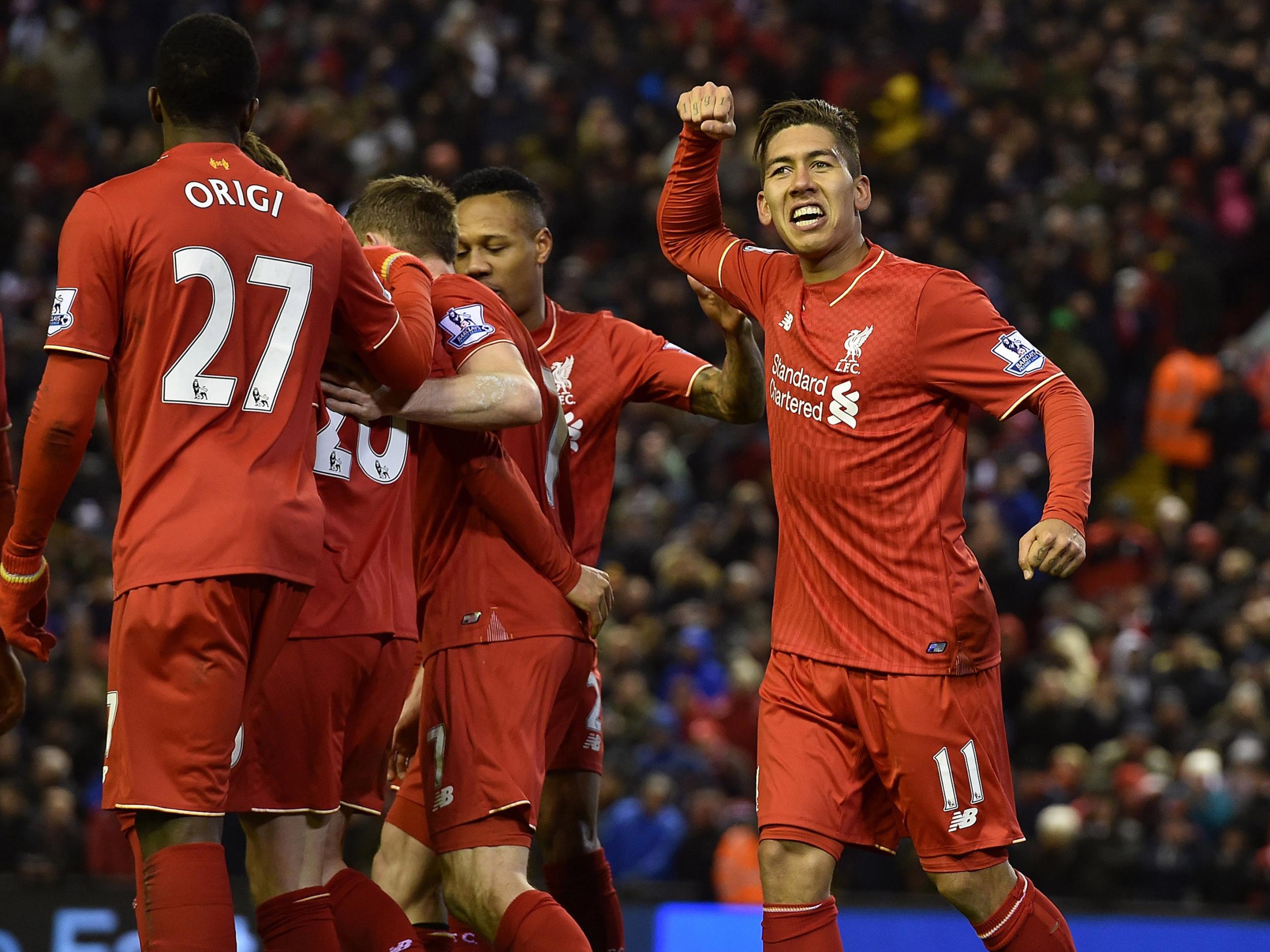 Roberto Firmino celebrates scoring against City