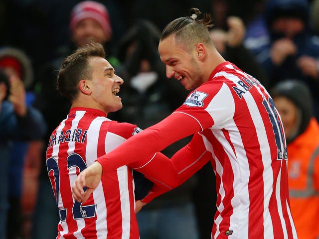 Stoke City's Xherdan Shaqiri celebrates with Marko Arnautovic