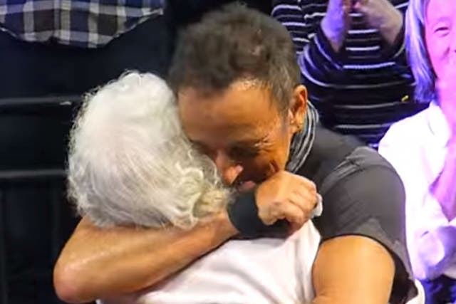 Bruce Springsteen hugs Jeannie Heintz during his The River Tour gig