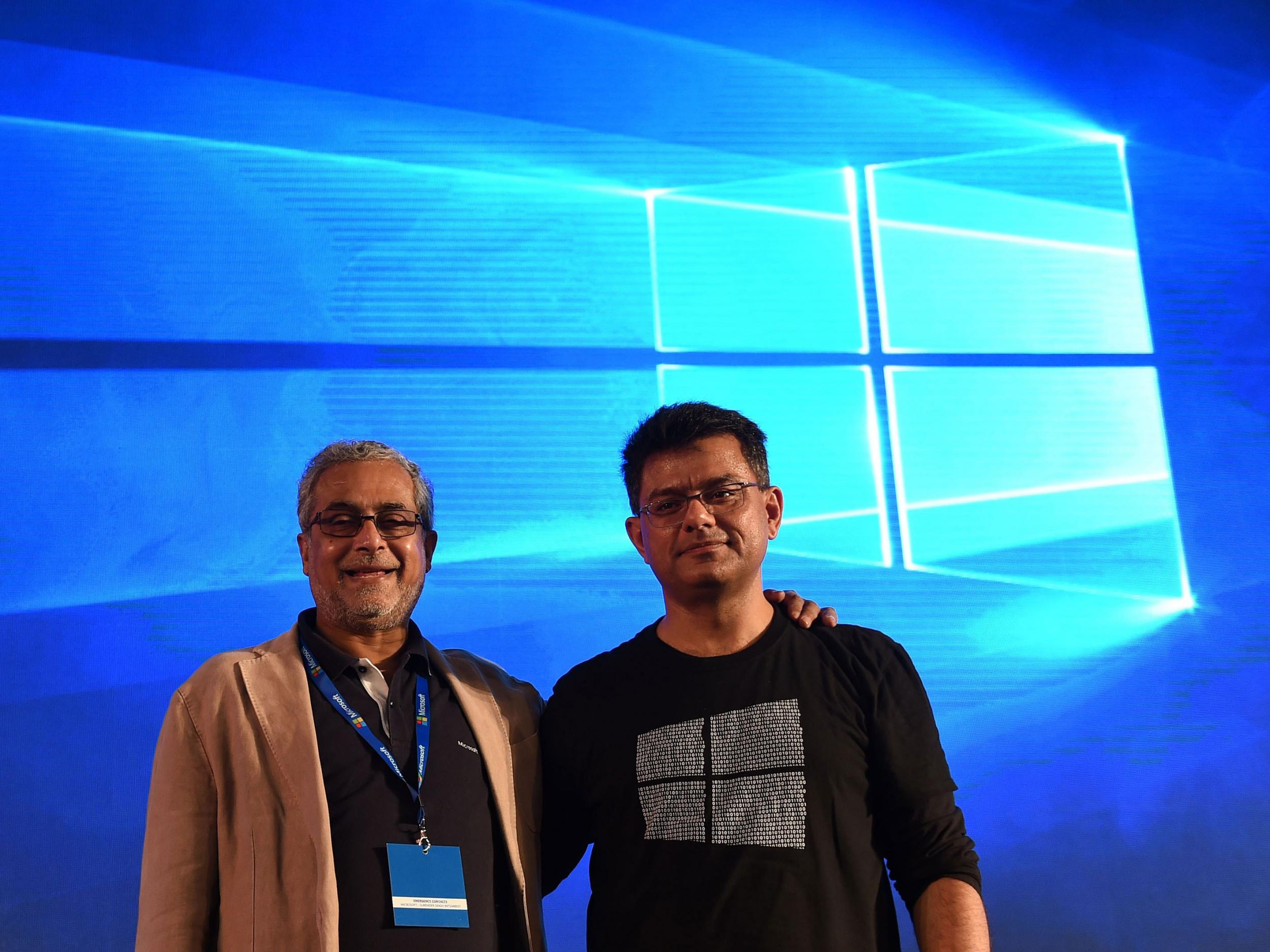 Chairman of Microsoft India Bhaskar Pramanik (L) poses with Director-Windows Business group Vineet Durani during the launch of Microsoft Windows 10 in New Delhi