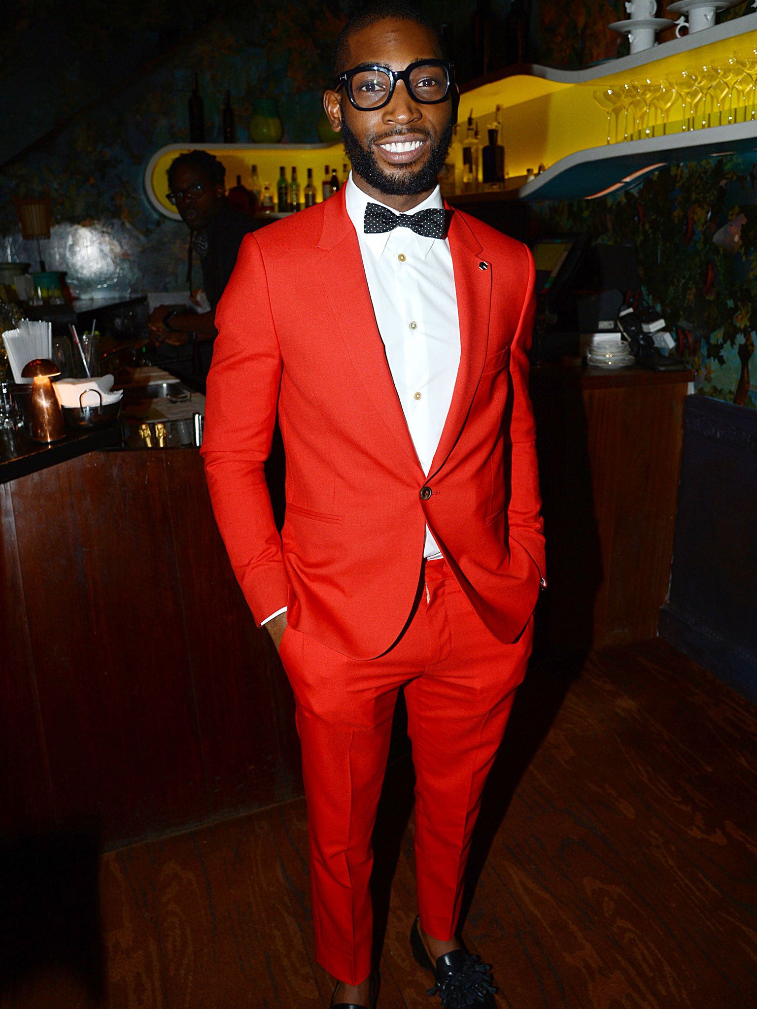 Tinie Tempah's modern style of red trousers are tighter and shorter at the bottom (Rex)