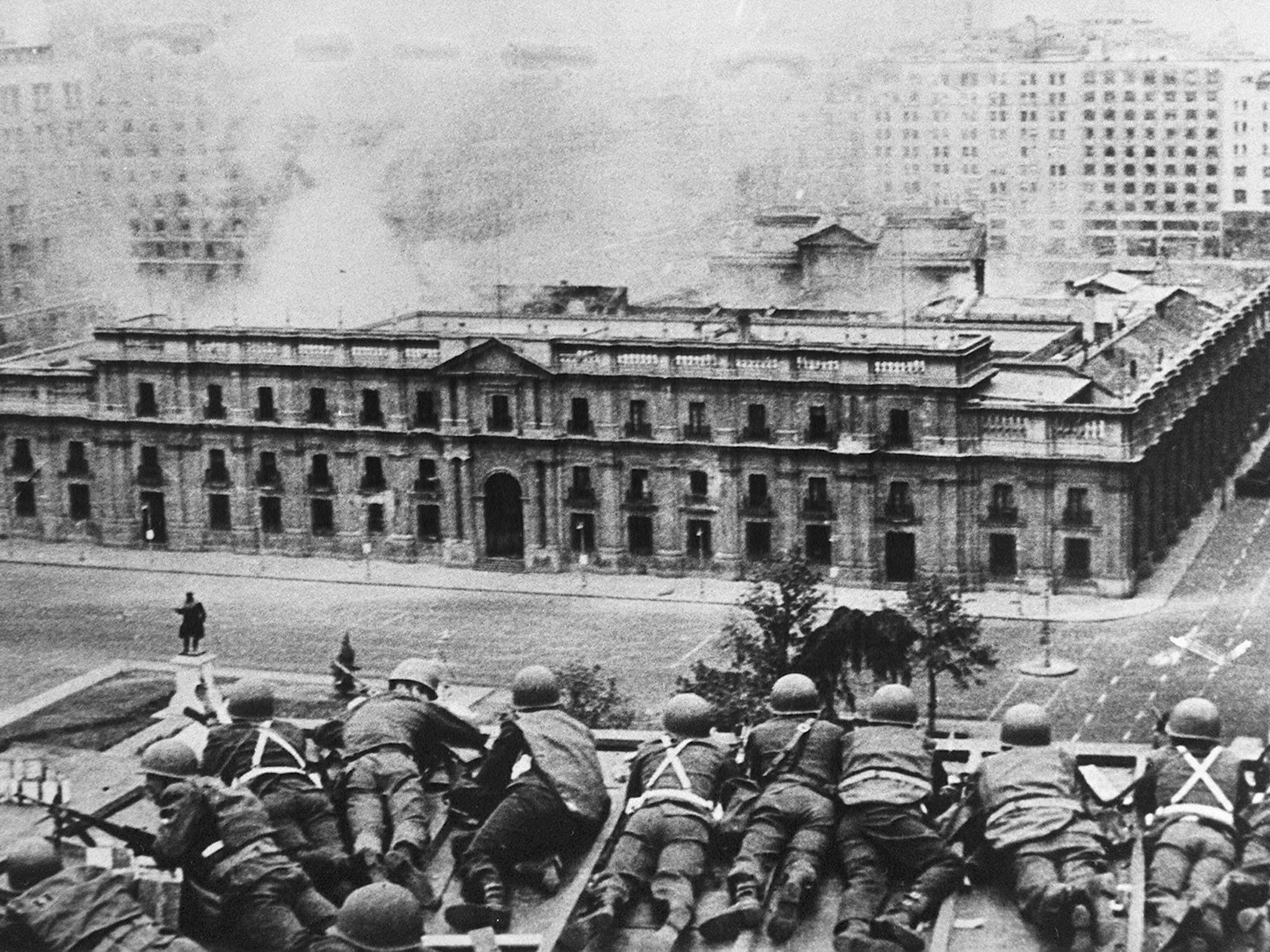 Chilean Army troops fire on La Moneda Palace, Santiago, during the 1973 coup led by General Augusto Pinochet. President Salvador Allende died in the attack