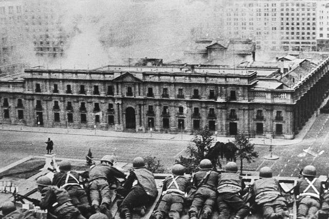 Chilean Army troops fire on La Moneda Palace, Santiago, during the 1973 coup led by General Augusto Pinochet. President Salvador Allende died in the attack