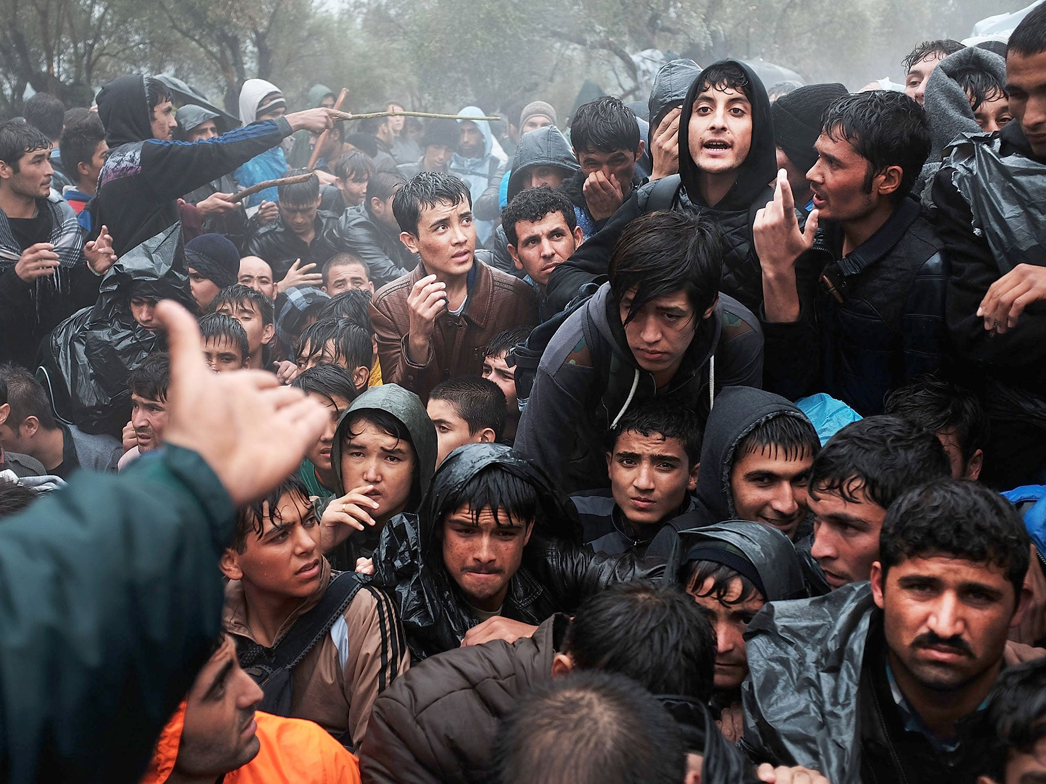 Asylum seekers from Afghanistan wait to be processed