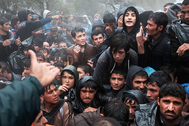 Asylum seekers from Afghanistan wait to be processed