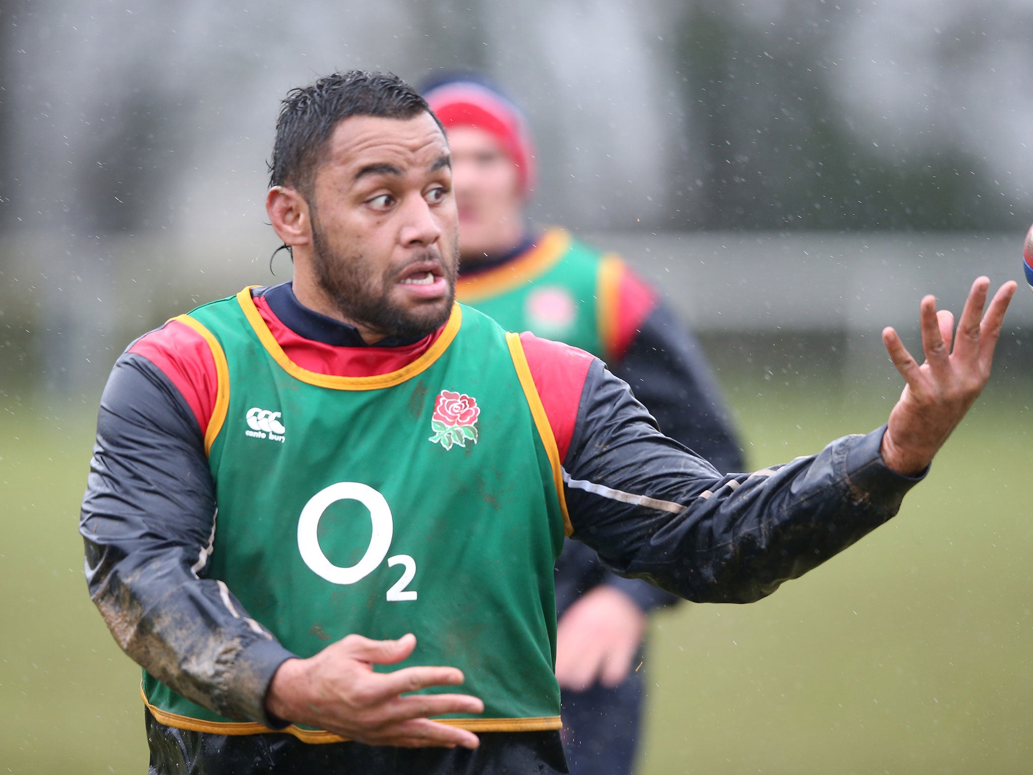 Billy Vunipola passes the ball during an England training session