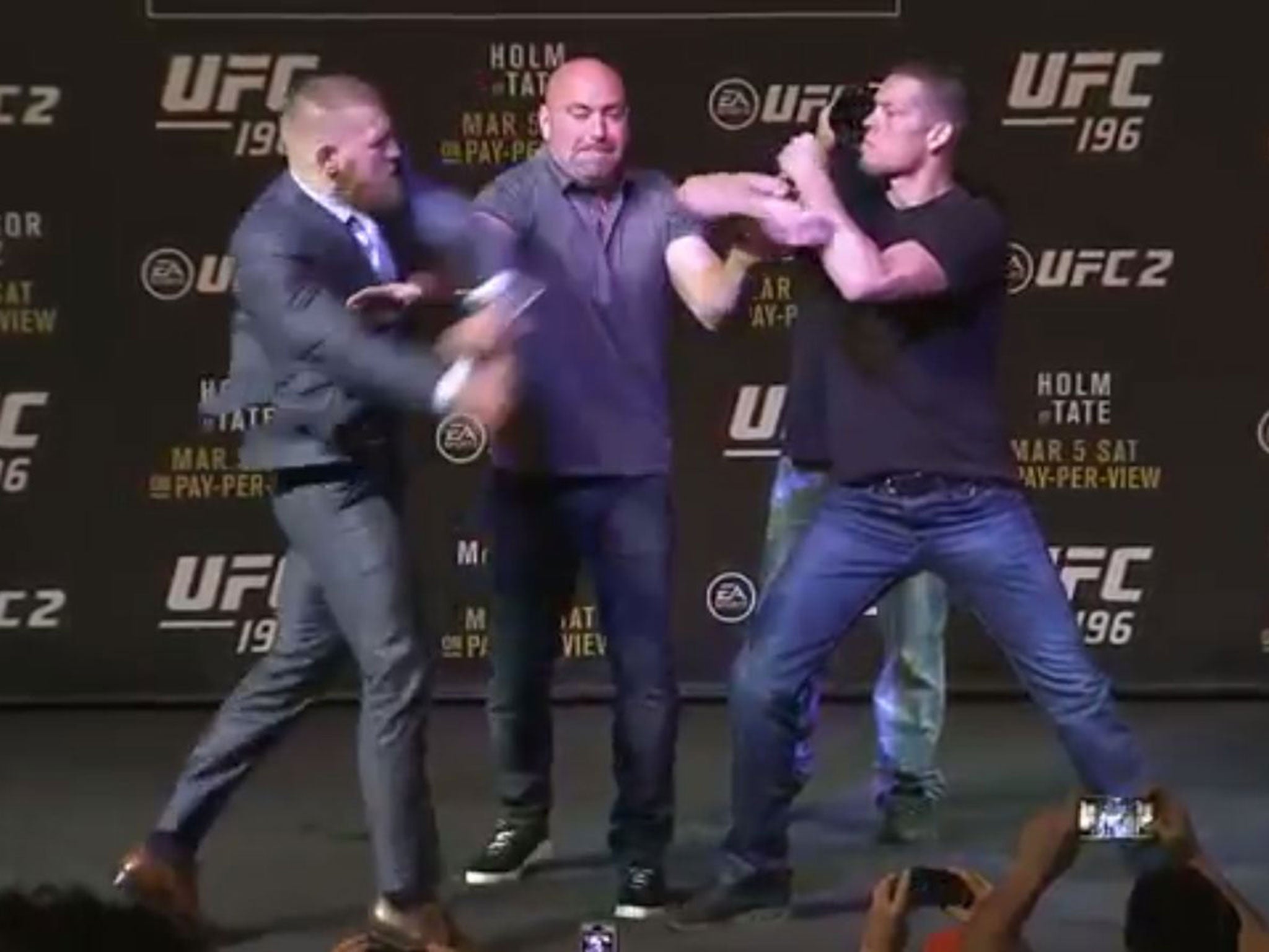 Conor McGregor and Nate Diaz are separated by UFC president Dana White