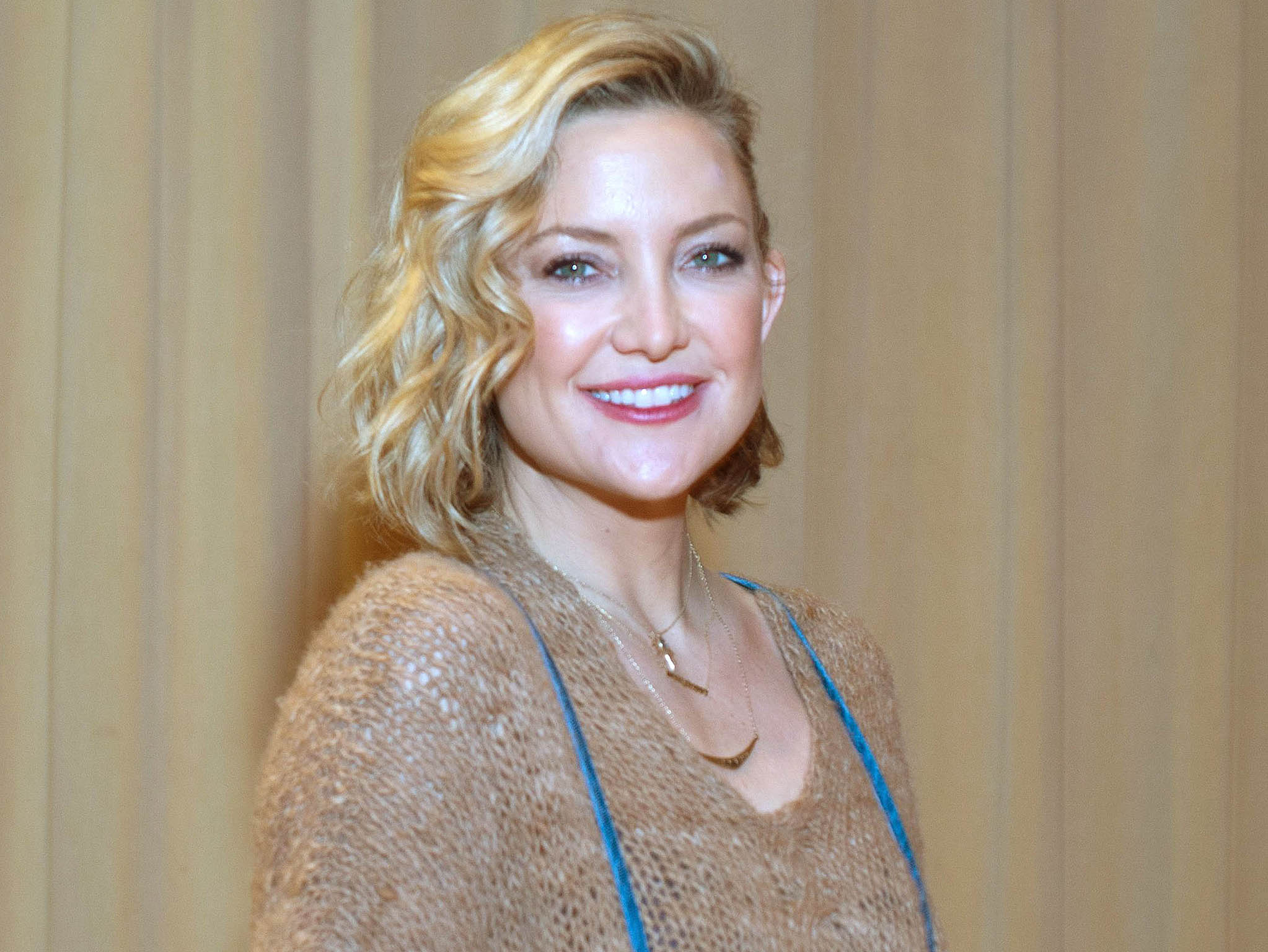 Golden smile: Kate Hudson, who has a new book about how to be happy Cindy Barrymore/REX