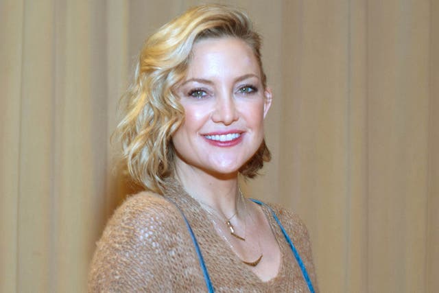 Golden smile: Kate Hudson, who has a new book about how to be happy Cindy Barrymore/REX