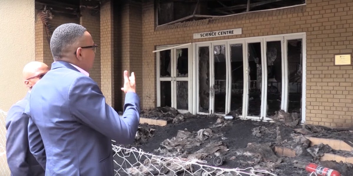 South Africa's deputy minister of higher education, Mduduzi Manana, inspects the damage to NWU's Science Centre