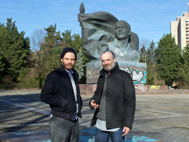 Daniel Brühl and Fran Healy photographed in front of the Ernst Thalmann monument in Berlin
